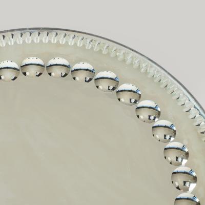 Circular 1900s sorcerers mirror tray stamped Made in England to back