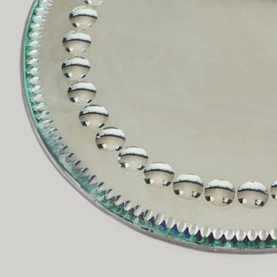 Circular 1900s sorcerers mirror tray stamped Made in England to back