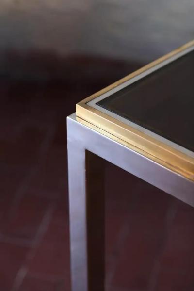 Coffee table in brass and chromed metal with smoked glass shelves Italy 1980