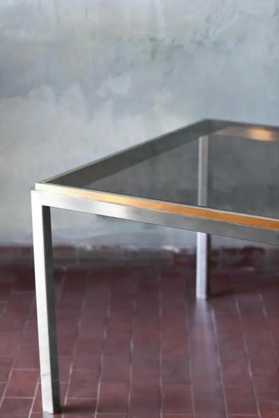 Coffee table in brass and chromed metal with smoked glass shelves Italy 1980