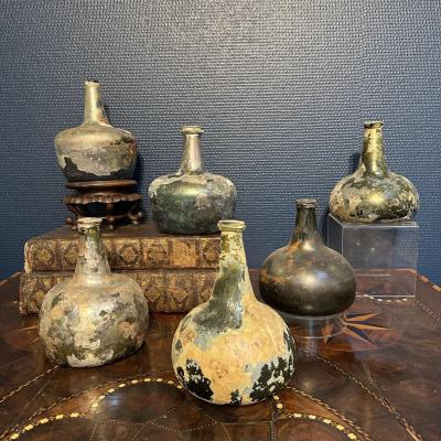 Collection of 17th and 18th century iridescent wine bottles