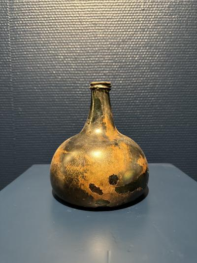 Collection of 17th and 18th century iridescent wine bottles