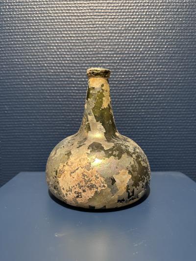 Collection of 17th and 18th century iridescent wine bottles
