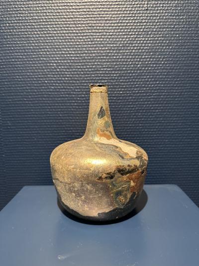 Collection of 17th and 18th century iridescent wine bottles