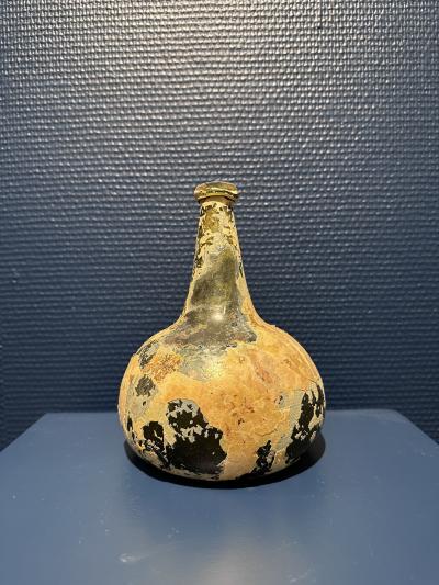 Collection of 17th and 18th century iridescent wine bottles