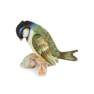 Collection of four 20th century bisque porcelain bird models