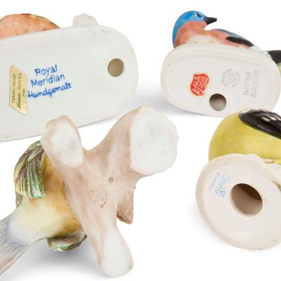 Collection of four 20th century bisque porcelain bird models