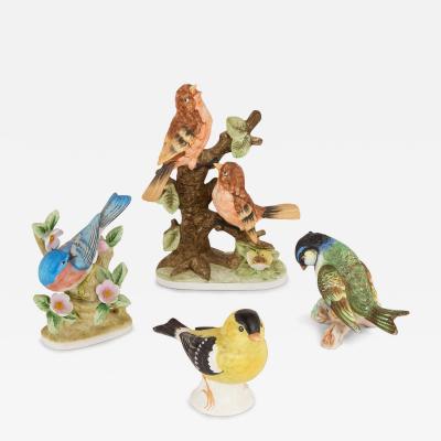 Collection of four 20th century bisque porcelain bird models