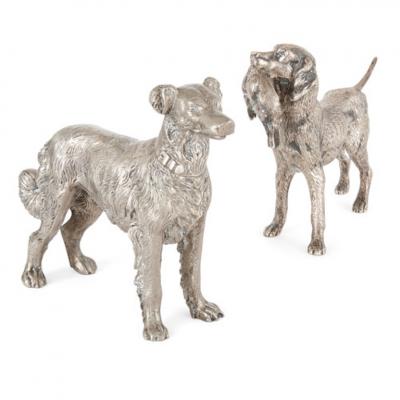 Collection of seven metal dogs of various types