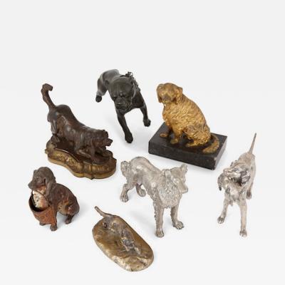 Collection of seven metal dogs of various types