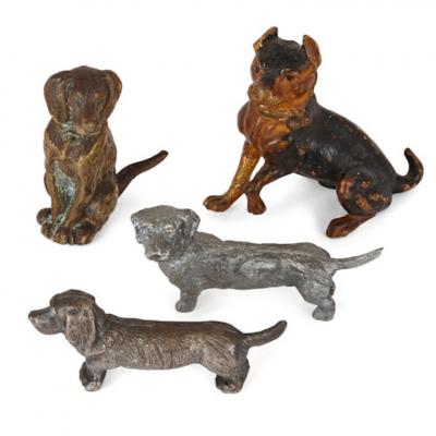 Collection of twenty metal dogs of various types