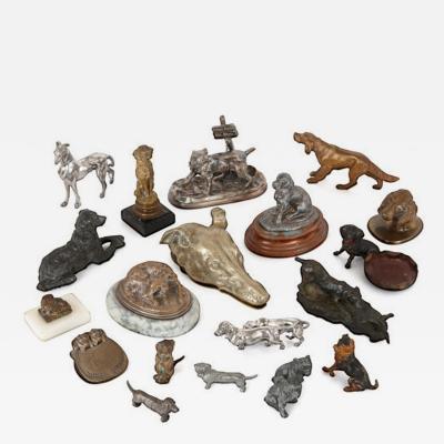 Collection of twenty metal dogs of various types