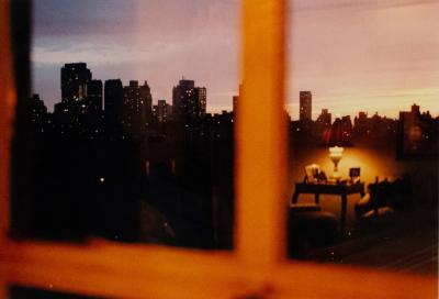 Color Photograph Of A Cityscape In A Window