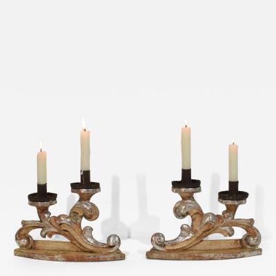 Couple of 18th Century Italian Baroque Carved Wooden And Silvered Candleholders