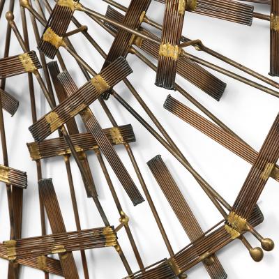 Curtis Jer A Mid Century circular brass and metal wall sculpture in the manner of C Jere