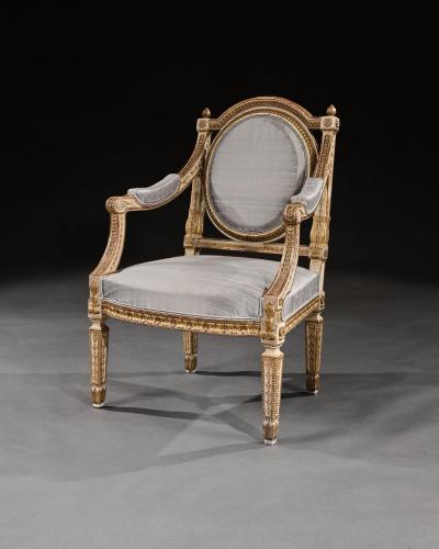 DECORATIVE ITALIAN PAINTED AND PARCEL GILT ARMCHAIRS OF NEO CLASSICAL DESIGN