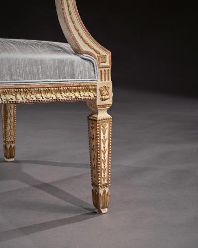 DECORATIVE ITALIAN PAINTED AND PARCEL GILT ARMCHAIRS OF NEO CLASSICAL DESIGN
