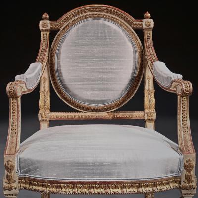 DECORATIVE ITALIAN PAINTED AND PARCEL GILT ARMCHAIRS OF NEO CLASSICAL DESIGN