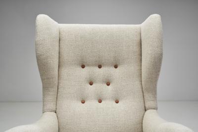 Danish Cabinetmaker Wing Back Chair with Stained Beech Legs Denmark 1940s