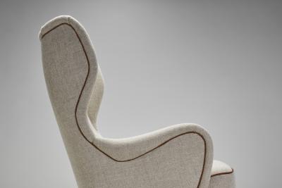 Danish Cabinetmaker Wing Back Chair with Stained Beech Legs Denmark 1940s