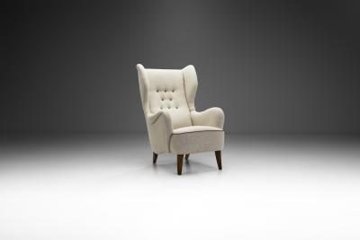 Danish Cabinetmaker Wing Back Chair with Stained Beech Legs Denmark 1940s