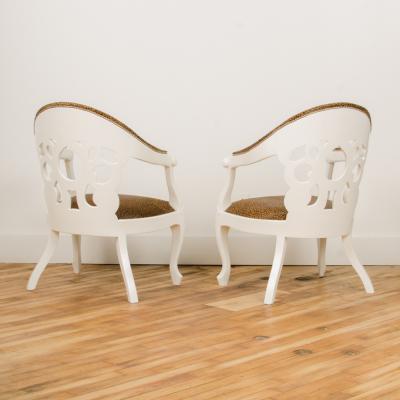 David Barrett A pair of white lacquered armchairs designed by D Barrett circa 1970
