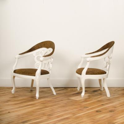 David Barrett A pair of white lacquered armchairs designed by D Barrett circa 1970
