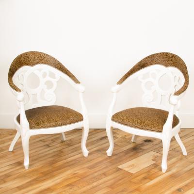 David Barrett A pair of white lacquered armchairs designed by D Barrett circa 1970