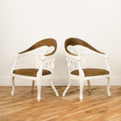 David Barrett A pair of white lacquered armchairs designed by D Barrett circa 1970