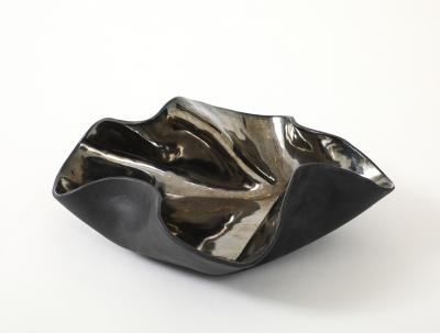 Decorative free form twist bowl in a highly reflective platinum finish