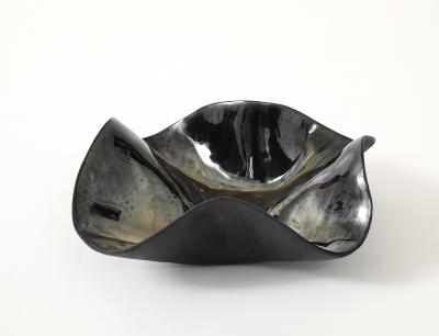 Decorative free form twist bowl in a highly reflective platinum finish 