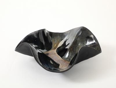 Decorative free form twist bowl in a highly reflective platinum finish 