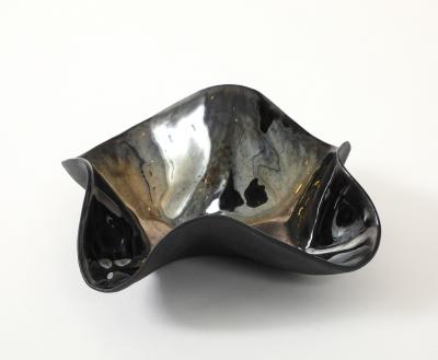 Decorative free form twist bowl in a highly reflective platinum finish 