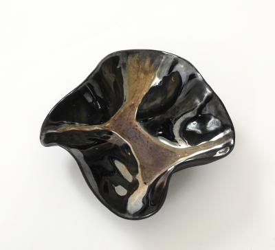 Decorative free form twist bowl in a highly reflective platinum finish 