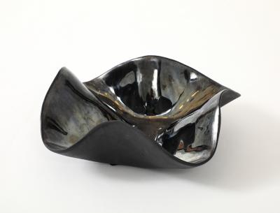 Decorative free form twist bowl in a highly reflective platinum finish 