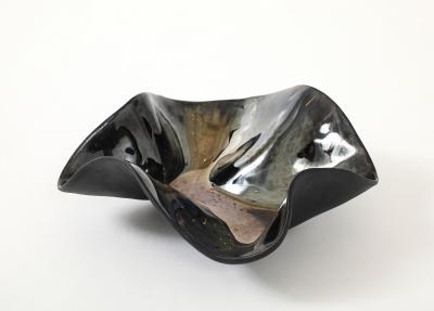 Decorative free form twist bowl in a highly reflective platinum finish 