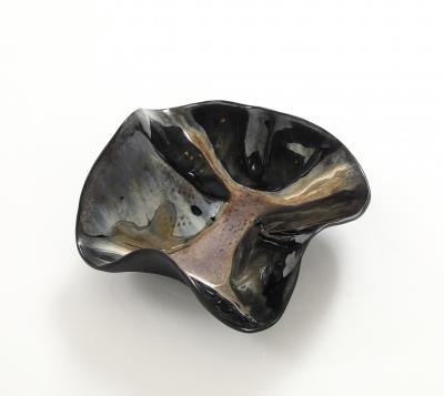 Decorative free form twist bowl in a highly reflective platinum finish 