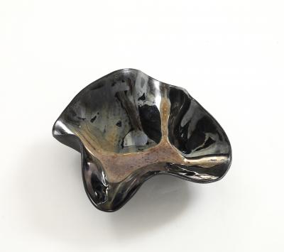 Decorative free form twist bowl in a highly reflective platinum finish 