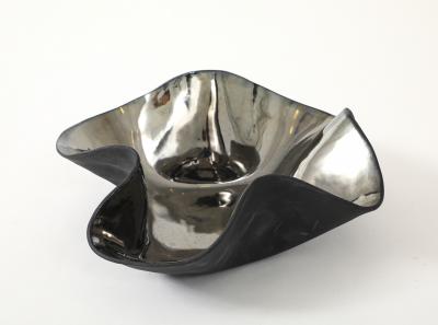 Decorative free form twist bowl in a highly reflective platinum finish