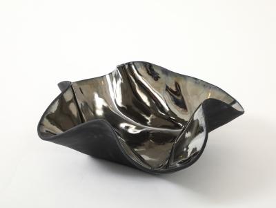 Decorative free form twist bowl in a highly reflective platinum finish