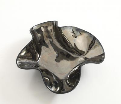 Decorative free form twist bowl in a highly reflective platinum finish