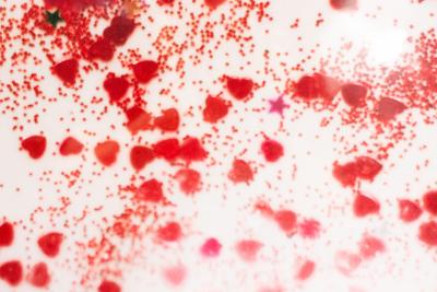 Detail Color Photograph Of Red Confetti