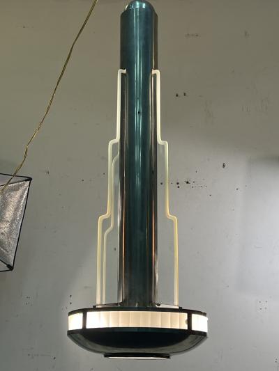 Donald Deskey EXCEPTIONAL PAIR OF MODERNIST ART DECO CHROME AND GLASS SKYSCRAPER CHANDELIERS