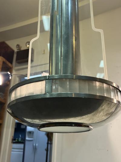 Donald Deskey EXCEPTIONAL PAIR OF MODERNIST ART DECO CHROME AND GLASS SKYSCRAPER CHANDELIERS