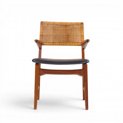E Knudsen for Jensen Lykkegaard Model 48 Danish Teak Cane Dining Arm Chair
