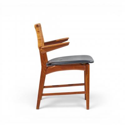 E Knudsen for Jensen Lykkegaard Model 48 Danish Teak Cane Dining Arm Chair