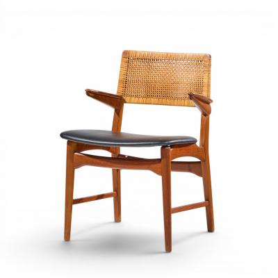 E Knudsen for Jensen Lykkegaard Model 48 Danish Teak Cane Dining Arm Chair