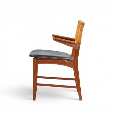 E Knudsen for Jensen Lykkegaard Model 48 Danish Teak Cane Dining Arm Chair