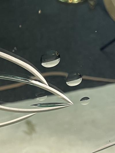 EXCEPTIONAL ART DECO PEACH AND CLEAR MIRROR WITH INCISED FISH AND BUBBLES