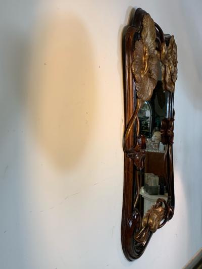 EXCEPTIONAL ART NOUVEAU CARVED AND GILT FLOWER MIRROR
